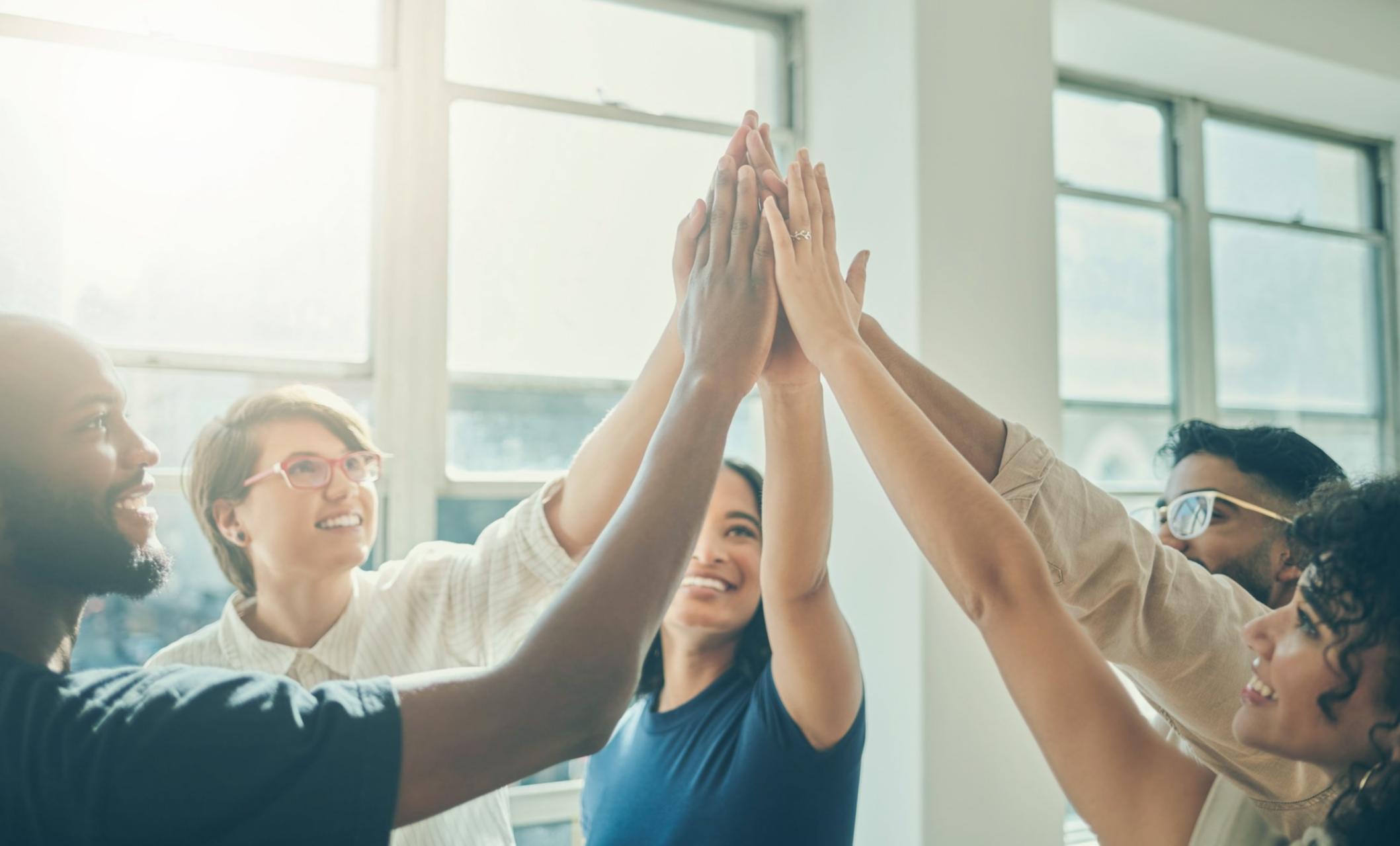 Entrepreneur reviewing financial documents and budget planning materials at a workspace